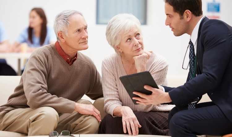 Old age people consulting case manager for knee replacement
